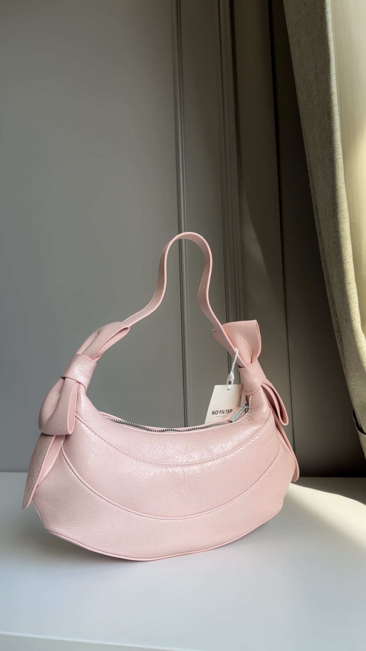 Bow shoulder bag