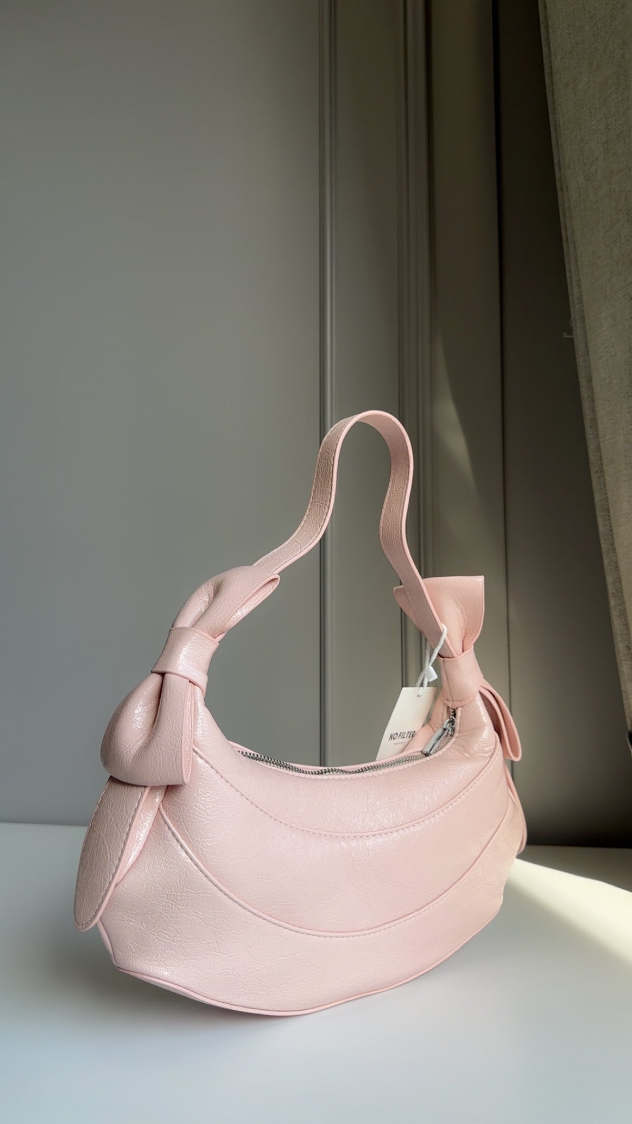 Bow shoulder bag